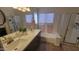 Bathroom with double vanity, soaking tub, and shower at 736 E Ivanhoe St, Chandler, AZ 85225