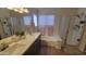 Bathroom with double vanity, soaking tub, and shower at 736 E Ivanhoe St, Chandler, AZ 85225