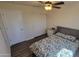 Bedroom with ceiling fan, double door closet and a comfortable bed at 736 E Ivanhoe St, Chandler, AZ 85225