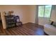 Bedroom with large window, comfortable chair, and ample floor space at 736 E Ivanhoe St, Chandler, AZ 85225