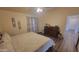 Spacious bedroom with a ceiling fan, dresser, and large window at 736 E Ivanhoe St, Chandler, AZ 85225