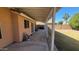 Covered patio with grassy backyard and seating at 736 E Ivanhoe St, Chandler, AZ 85225