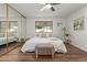 Bright bedroom featuring a queen-size bed and mirrored closet at 7638 E Northland Dr, Scottsdale, AZ 85251