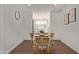 Cozy dining area with a wooden table and rattan chairs at 7638 E Northland Dr, Scottsdale, AZ 85251