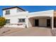 Front view of a charming Spanish-style home with carport at 7638 E Northland Dr, Scottsdale, AZ 85251