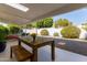 Relaxing patio with outdoor table and chairs, surrounded by greenery at 7638 E Northland Dr, Scottsdale, AZ 85251