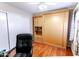 Bedroom with wood flooring, built-in Murphy bed and office area at 7708 E Park View Dr Dr, Mesa, AZ 85208