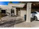 House exterior showcasing a covered patio area with seating and a car parked under at 7708 E Park View Dr Dr, Mesa, AZ 85208