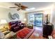 Spacious living room featuring hardwood floors and sliding glass doors to a patio at 7708 E Park View Dr Dr, Mesa, AZ 85208