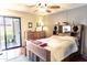 Main bedroom with wood flooring, dresser, and patio access at 7708 E Park View Dr Dr, Mesa, AZ 85208