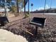 Communal BBQ grill in a gravel area at 8147 W Hilton Ave, Phoenix, AZ 85043