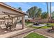 Covered patio with dining furniture and pool view at 8147 W Hilton Ave, Phoenix, AZ 85043