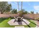 Patio area with seating and artificial turf at 8147 W Hilton Ave, Phoenix, AZ 85043