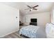 Spacious bedroom with a bed and ceiling fan at 8147 W Hilton Ave, Phoenix, AZ 85043