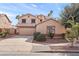 Two-story house with attached garage and landscaping at 8147 W Hilton Ave, Phoenix, AZ 85043