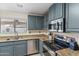 Granite countertop kitchen with stainless steel appliances at 8147 W Hilton Ave, Phoenix, AZ 85043