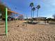 Sand playground with swings and shaded seating area at 8147 W Hilton Ave, Phoenix, AZ 85043