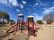 playground with slides and climbing structures at 8147 W Hilton Ave, Phoenix, AZ 85043