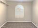 Bedroom with carpet flooring, neutral walls, and an arched window at 854 W Mesquite St, Gilbert, AZ 85233