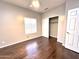 Well-lit bedroom featuring dark wood floors and a sizable closet at 854 W Mesquite St, Gilbert, AZ 85233