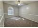 Bedroom with carpet flooring, neutral walls, and an arched window at 854 W Mesquite St, Gilbert, AZ 85233