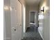 Clean hallway with tiled floors and access to other rooms at 854 W Mesquite St, Gilbert, AZ 85233