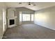 Living room boasts a fireplace and large windows at 854 W Mesquite St, Gilbert, AZ 85233