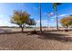 Backyard with gravel and view of golf course at 9183 W Century Dr, Arizona City, AZ 85123