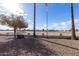 Backyard with gravel and view of golf course at 9183 W Century Dr, Arizona City, AZ 85123