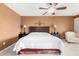 Spacious bedroom with king-size bed and ceiling fan at 9183 W Century Dr, Arizona City, AZ 85123