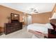 Main bedroom with king bed, dresser, and en-suite bathroom access at 9183 W Century Dr, Arizona City, AZ 85123