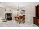 Dining area with wood table and chairs near fireplace at 9183 W Century Dr, Arizona City, AZ 85123