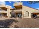 Back exterior view of property with patio and landscaping at 9183 W Century Dr, Arizona City, AZ 85123