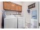 Laundry room with washer, dryer, and water dispenser at 9183 W Century Dr, Arizona City, AZ 85123