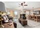 Open living and dining area with fireplace and tiled floors at 9183 W Century Dr, Arizona City, AZ 85123