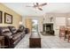 Open living and dining area with fireplace and tiled floors at 9183 W Century Dr, Arizona City, AZ 85123