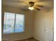 Simple bedroom with a window and neutral walls at 9841 E Forge Ave, Mesa, AZ 85208