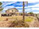Spacious backyard featuring a pool, grotto, and covered patio at 11163 W Edgemont Ave, Avondale, AZ 85392