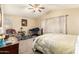 Cozy bedroom with vaulted ceiling, ceiling fan, and comfortable furnishings at 11163 W Edgemont Ave, Avondale, AZ 85392