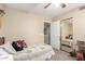 Cozy bedroom features mirrored closet doors and ceiling fan at 11163 W Edgemont Ave, Avondale, AZ 85392