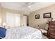 Bedroom with ample closet space, ceiling fan, and neutral color palette at 11163 W Edgemont Ave, Avondale, AZ 85392