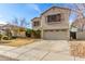 Charming two-story home with a well-maintained lawn and desert landscaping at 11163 W Edgemont Ave, Avondale, AZ 85392