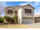 Charming two-story home featuring a large two car garage and desert landscaping at 11163 W Edgemont Ave, Avondale, AZ 85392
