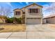 Charming two-story home featuring a large two car garage and desert landscaping at 11163 W Edgemont Ave, Avondale, AZ 85392