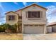 Charming two-story home with a well-maintained lawn and desert landscaping at 11163 W Edgemont Ave, Avondale, AZ 85392