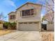 Charming two-story home featuring a large two car garage and desert landscaping at 11163 W Edgemont Ave, Avondale, AZ 85392