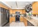 Well-equipped kitchen with stainless steel appliances, granite countertops, and ample cabinet space at 11163 W Edgemont Ave, Avondale, AZ 85392