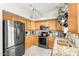 Updated kitchen with stainless steel appliances, granite countertops, and plenty of storage space at 11163 W Edgemont Ave, Avondale, AZ 85392