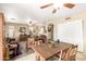 Spacious living area with dining table, ceiling fans, and comfortable seating, ideal for Gathering gatherings at 11163 W Edgemont Ave, Avondale, AZ 85392