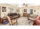 Cozy living room featuring a leather sofa, rocking chair and natural light at 11163 W Edgemont Ave, Avondale, AZ 85392